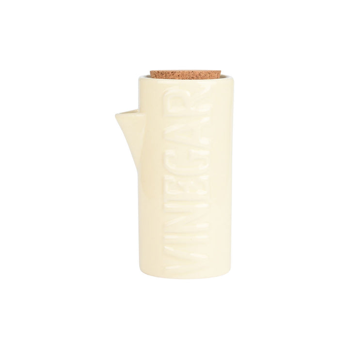 Κεραμικό δοχείο λαδιού σε ιβουάρ απόχρωση με ανάγλυφη επιγραφή VINEGAR και καπάκι από φελλό σε λευκό φόντο.