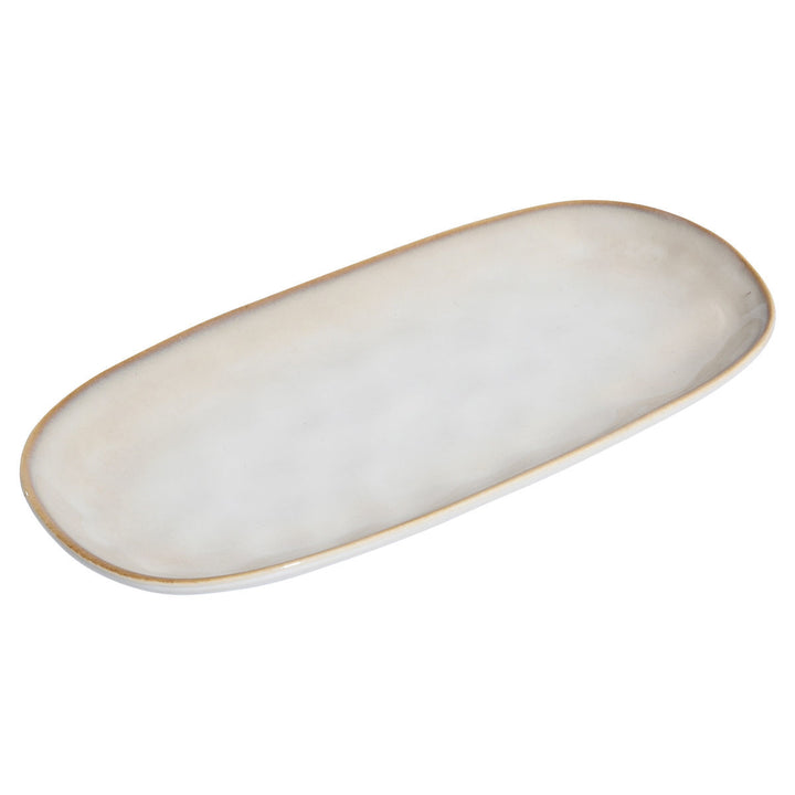 Οβάλ πιατέλα stoneware σε ivory χρώμα με απαλή υφή και λεπτό σκουρόχρωμο περίγραμμα, απομονωμένη σε λευκό φόντο.