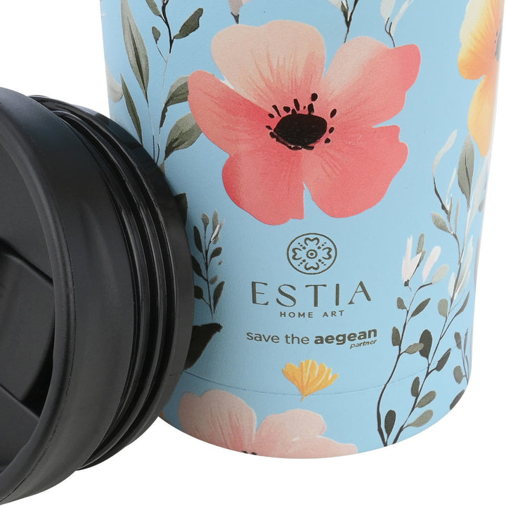 Κοντινό σε λογότυπου estia home art θερμού ταξιδιού με ξεβιδωμένο μαύρο καπάκι δίπλα