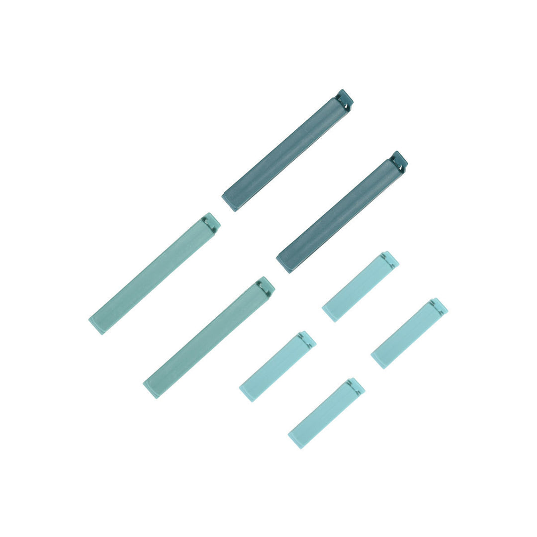 Μικρά και μεγάλα κλιπ σακουλών Estia σε μέντα χρώμα τοποθετημένα συμμετρικά σε λευκό φόντο.