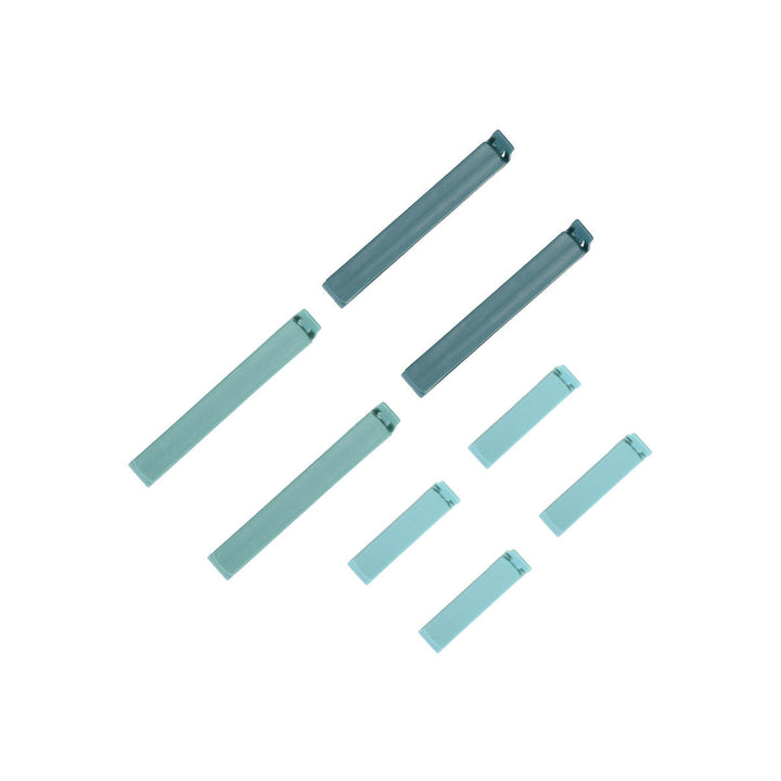 Μικρά και μεγάλα κλιπ σακουλών Estia σε μέντα χρώμα τοποθετημένα συμμετρικά σε λευκό φόντο.