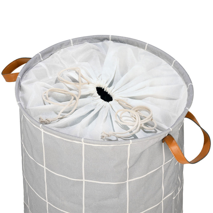 Εσωτερικό καλαθιού άπλυτων Estia με υφασμάτινο κάλυμμα και κορδόνι σύσφιξης στο άνοιγμα.