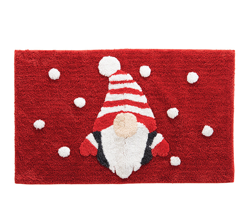 Κόκκινο χαλάκι μπάνιου με χριστουγεννιάτικο σχέδιο νάνου με ριγέ σκουφί και λευκές νιφάδες, σε απαλή υφή και γιορτινό ύφος.