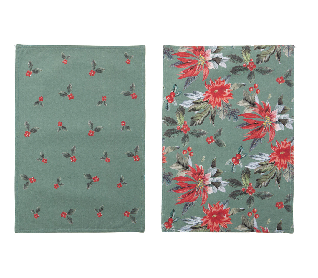 Χριστουγεννιάτικο σουπλά δύο όψεων σε πράσινη βάση, η μία πλευρά με σχέδιο κόκκινες αλεξανδρινές και η άλλη με μικρά μοτίβα γκι.