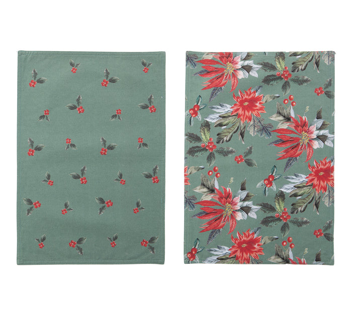 Χριστουγεννιάτικο σουπλά δύο όψεων σε πράσινη βάση, η μία πλευρά με σχέδιο κόκκινες αλεξανδρινές και η άλλη με μικρά μοτίβα γκι.