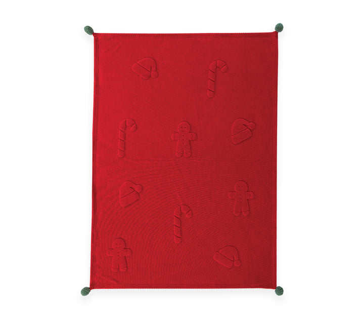 Κόκκινη χριστουγεννιάτικη fleece κουβέρτα με ανάγλυφα σχέδια gingerbread, ζαχαρωτά και σκούφο Άγιου Βασίλη, διακοσμημένη με πράσινες φουντίτσες στις γωνίες