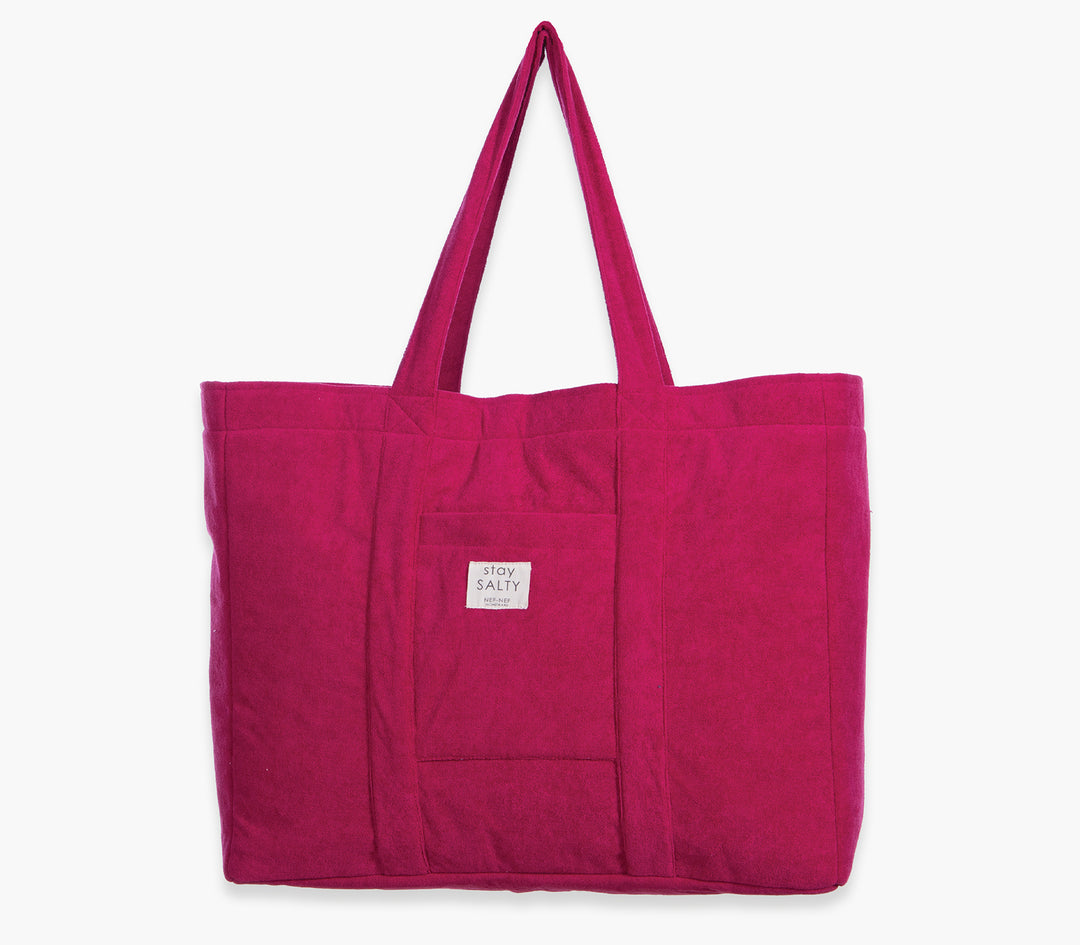 Σαγκριά τσάντα θαλάσσης μονόχρωμη με υφασμάτινες λαβές και εξωτερική τσέπη σε λευκό φόντο.