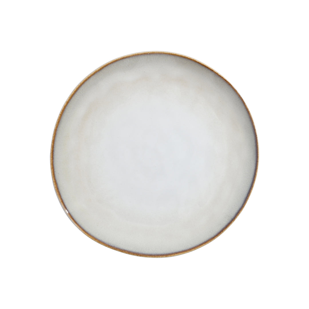 Ρηχό πιάτο Vignette της Estia σε ivory απόχρωση, φωτογραφημένο από πάνω με ελαφρώς ακανόνιστο σχήμα.