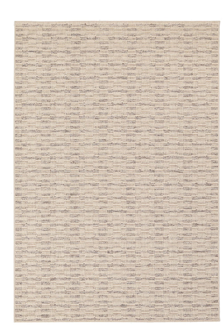 Καλοκαιρινό χαλί σε φυσικές αποχρώσεις με διακριτικό ανάγλυφο σχέδιο.