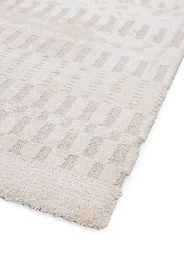 Χαλί Cocoon της Royal Carpet σε ουδέτερη απόχρωση, σε κοντινή λεπτομέρεια, με προσεγμένο σχέδιο της σειράς και εμφανή υφή επιφάνειας.